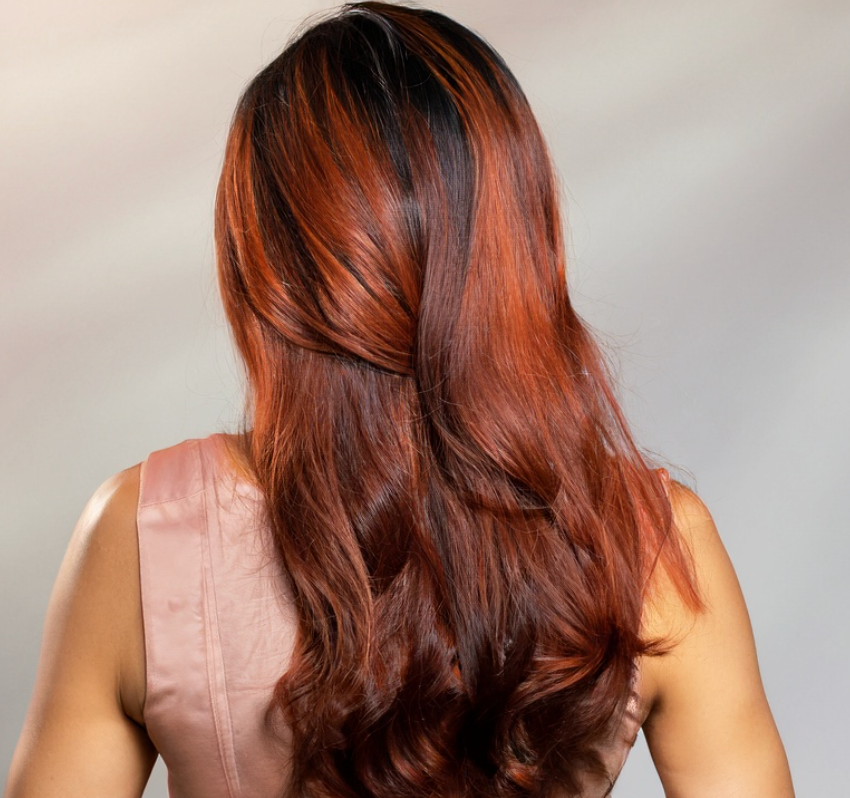 Auburn red highlighted on dark brown hair