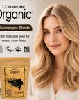 Woman with blonde hair next to a packet of Colour Me Organic hair color, with branding and product details.