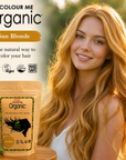 Woman with sun blonde hair next to 'Colour Me Organic' hair color packaging
