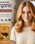 Woman with light reddish blonde hair next to a 'Colour Me Organic' hair color package.