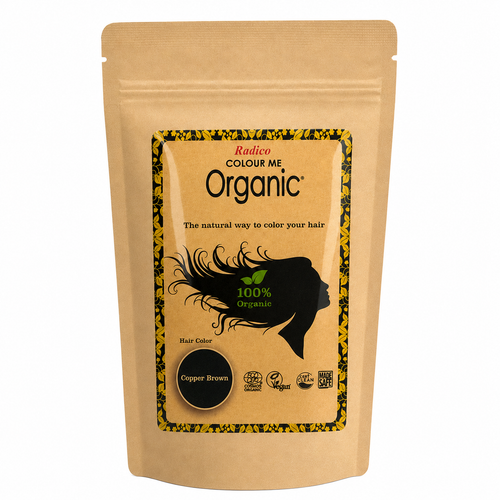 A stand-up kraft paper pouch of Radion Colour Me Organic Hair Color in Copper Brown, featuring a black and yellow graphic label with a silhouette of a woman and a circular copper-brown color swatch.